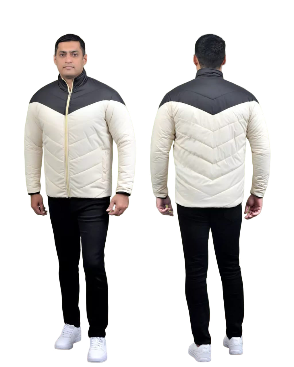 Person wearing a two-tone quilted jacket with black and white colors, standing against a green background.