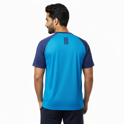 Man wearing a blue athletic shirt with a brand logo on the back against a white background