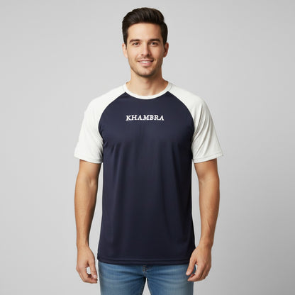 Men wearing a navy and white t-shirt with 'Khambra' logo on a gray background