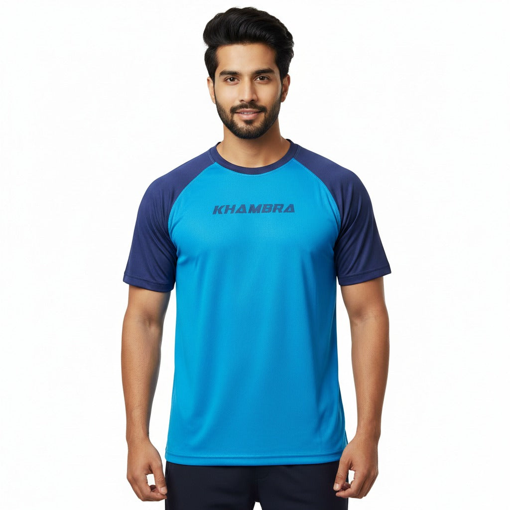 Man wearing a blue and navy sports shirt with 'Khambra' branding on a white background