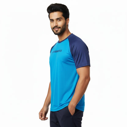 Man wearing a blue and navy sports shirt on a white background