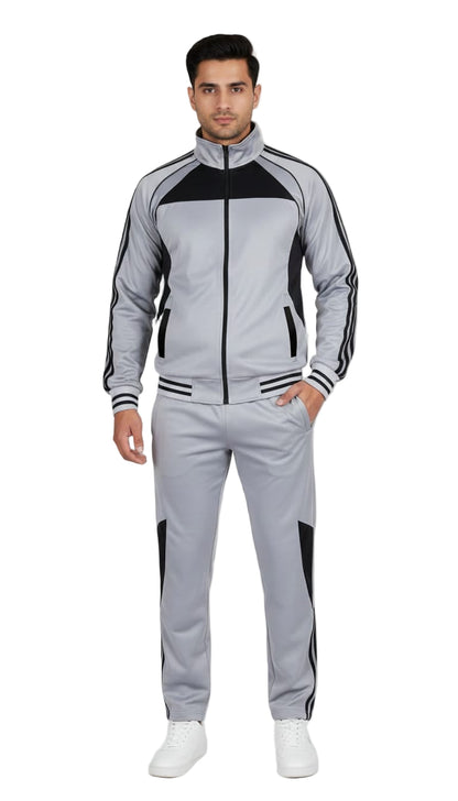 Man wearing a gray and black tracksuit on a white background