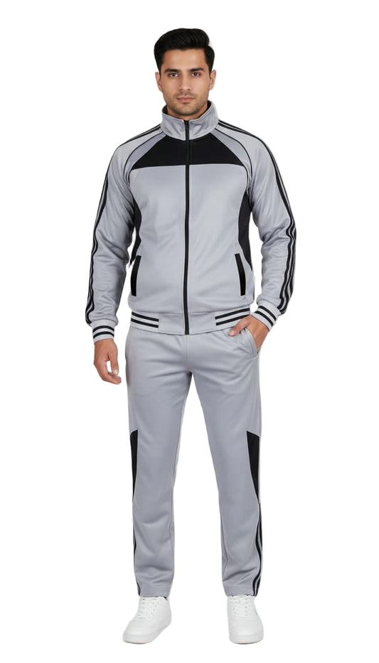 Man wearing a gray and black tracksuit on a white background