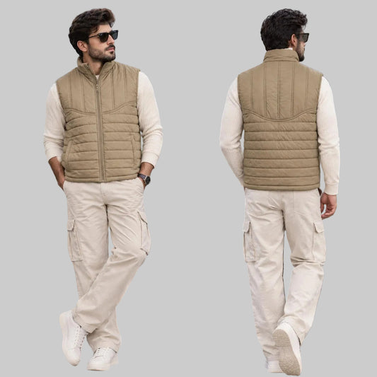 A man wearing a tan quilted zip-front vest over a cream long-sleeve shirt and off-white cargo pants, shown in a split front and back view against an outdoor mountain and lodge background.