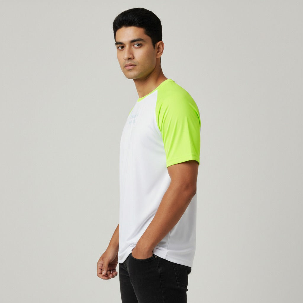 Man wearing a white and green t shirt on a gray background