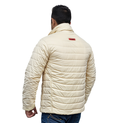 lightweight cream puffer jacket showing deep pockets and sleeve fit