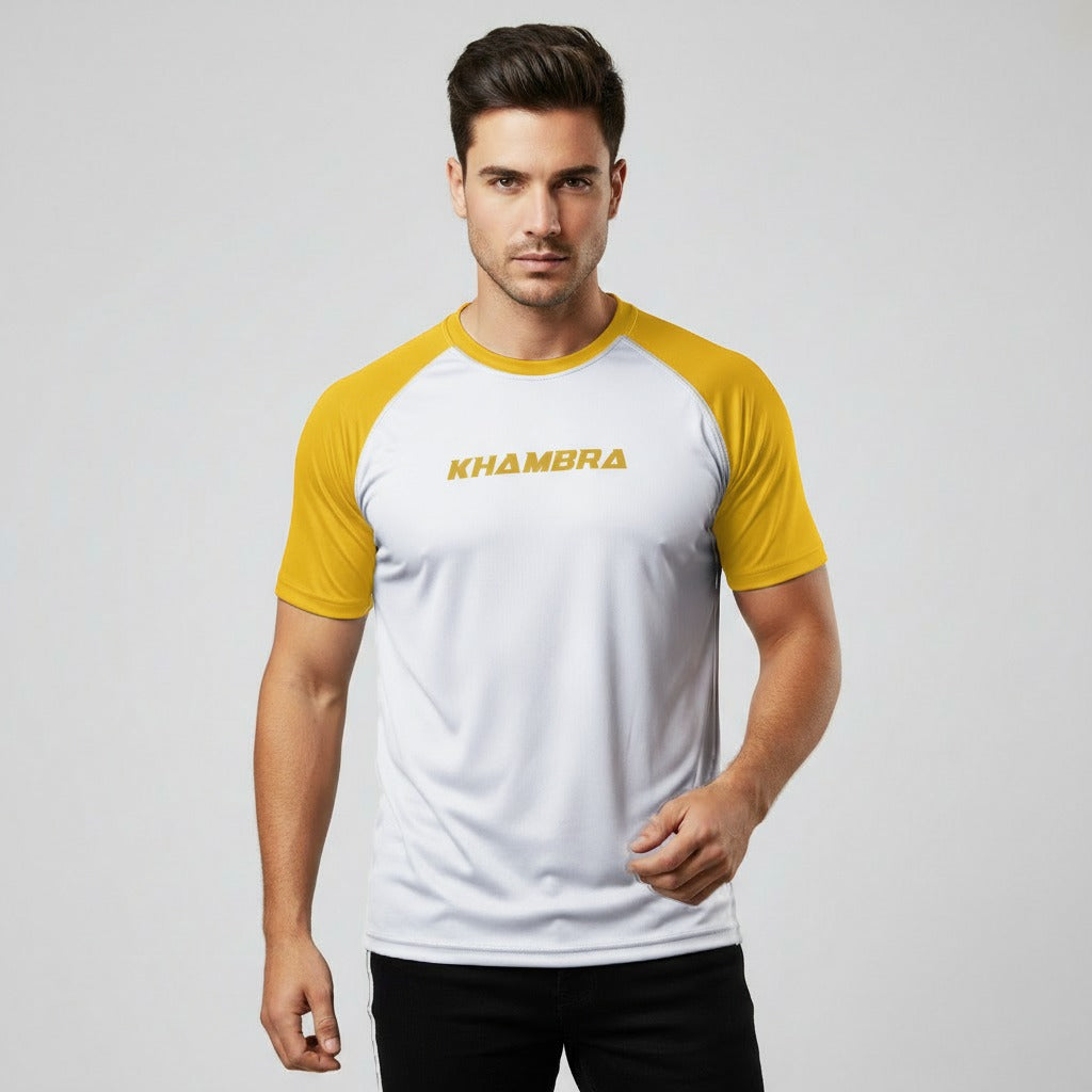 Man wearing a white and yellow 'Khambra' t-shirt on a light gray background